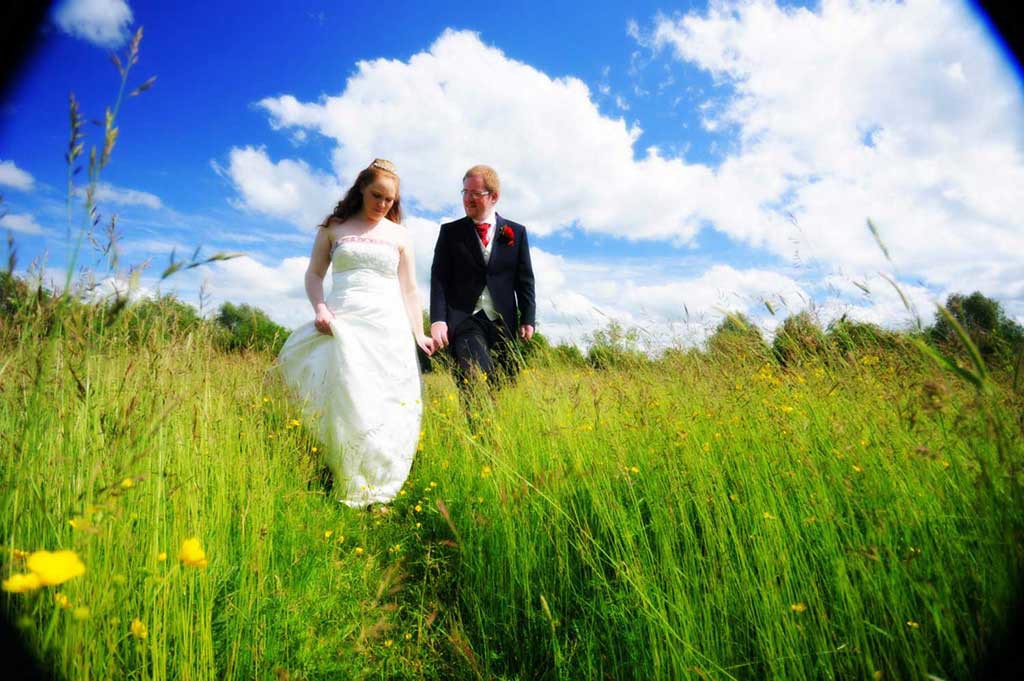 Isaac and Debs had selected a stunning spot for their wedding photos with a beautiful meadow full of wild flowers as their background.