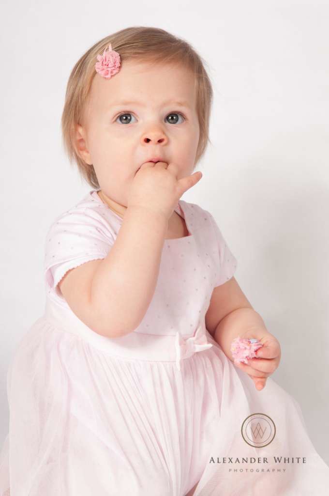 Eating cake at a cake smash