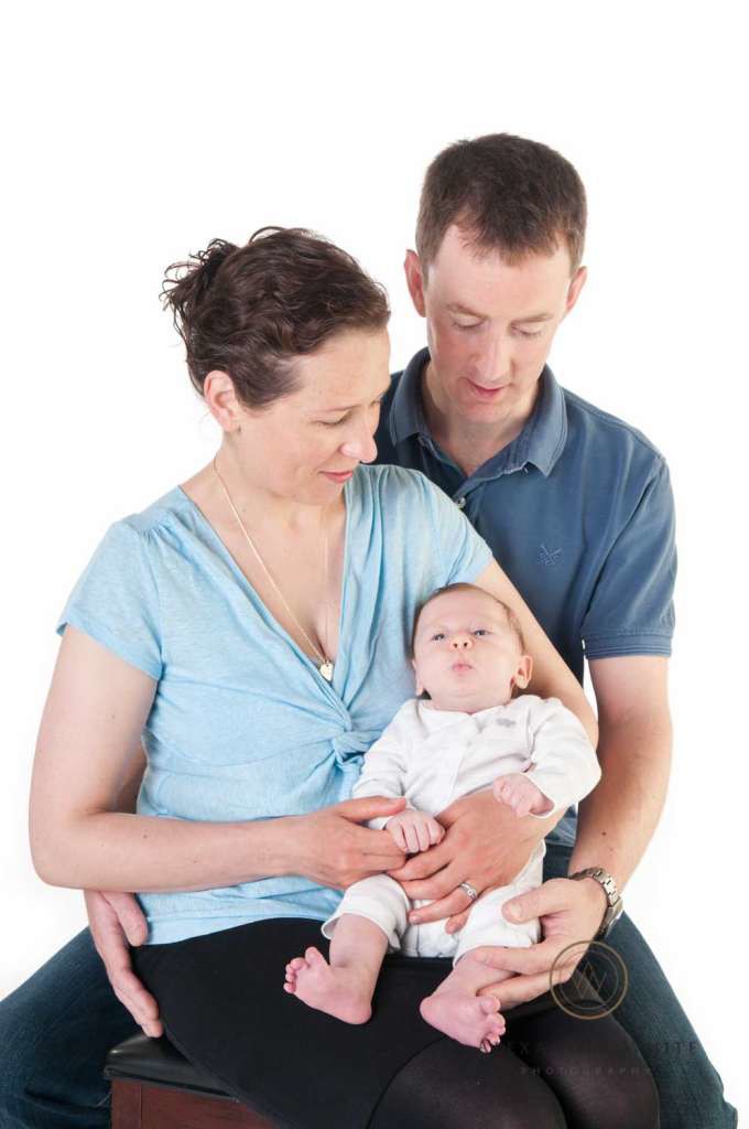 A beautiful family portrait showing off baby Thomas and his proud parents.