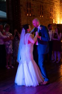 Wedding photo of the couple doing their first dance