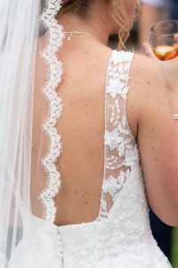 wedding photo of the detailing on the back of the bride's dress