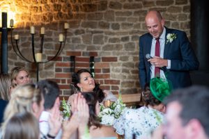 wedding photo of the groom giving his speech