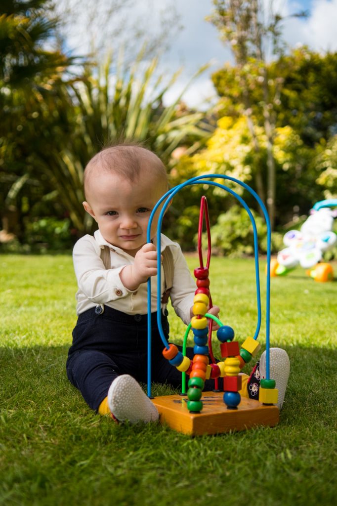 Young boy playing with a toy