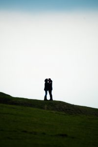 Alex and Emily sharing a kiss just before Alex proposed