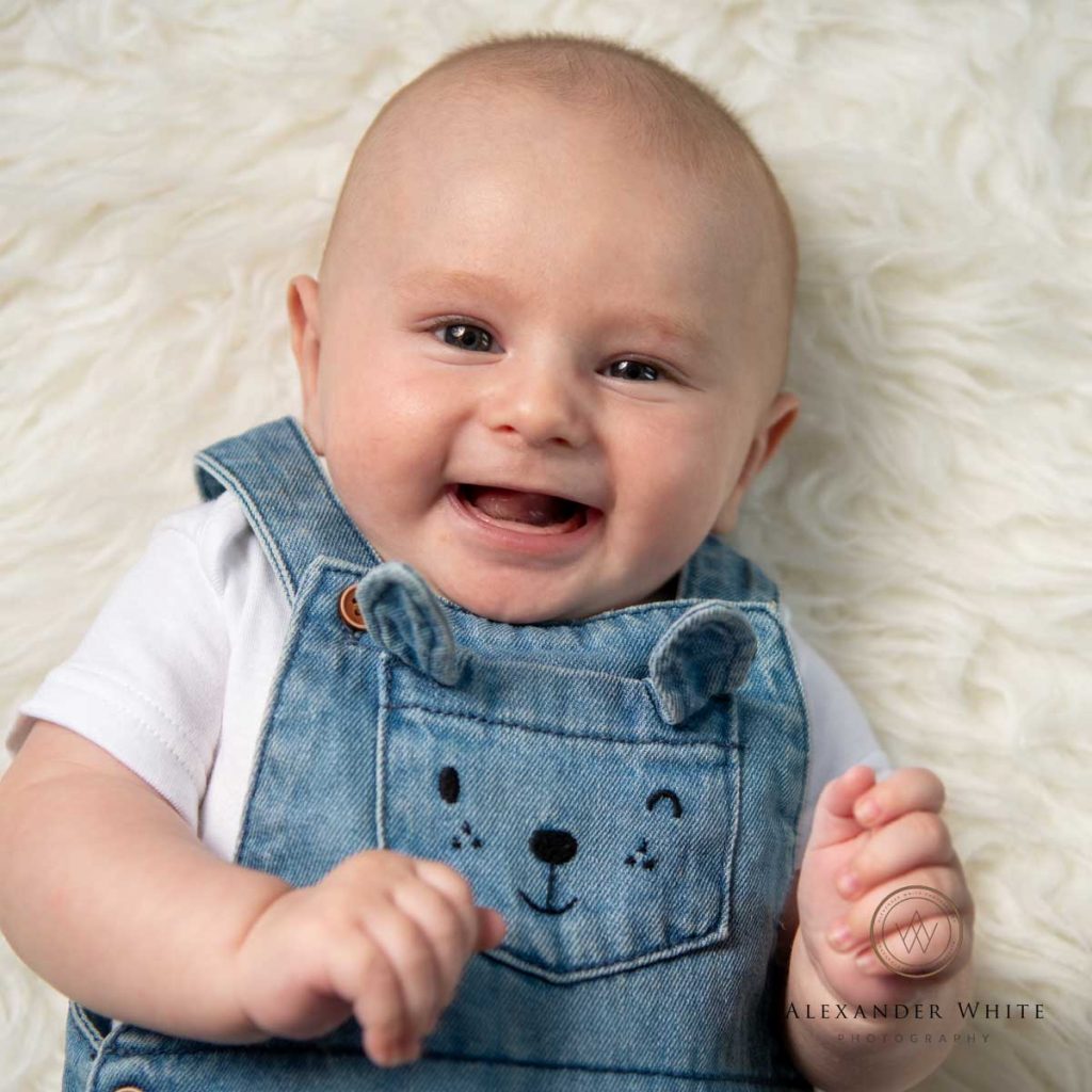 newborn baby photo with smiling baby