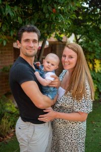 Young family with their baby for a family photo