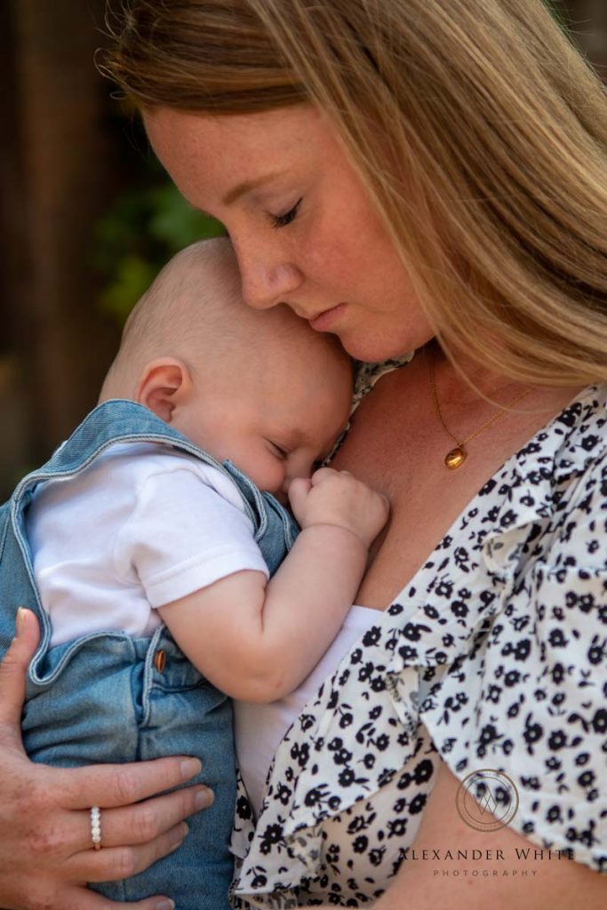 mother and newborn cuddling