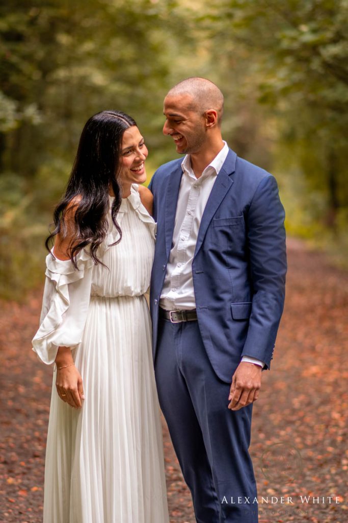 Couple laughing together after getting engaged