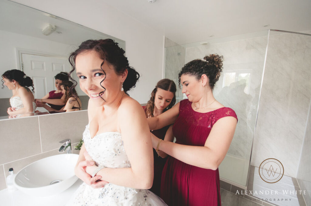 bride and bridesmaids getting ready
