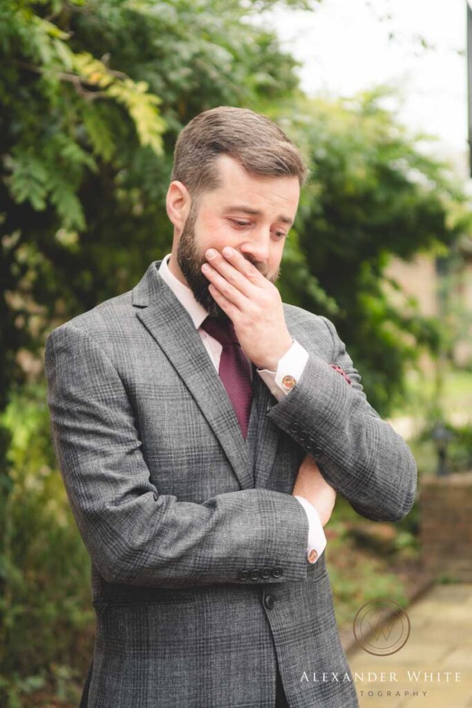 Groom's tears as he sees the bride walking down the aisle