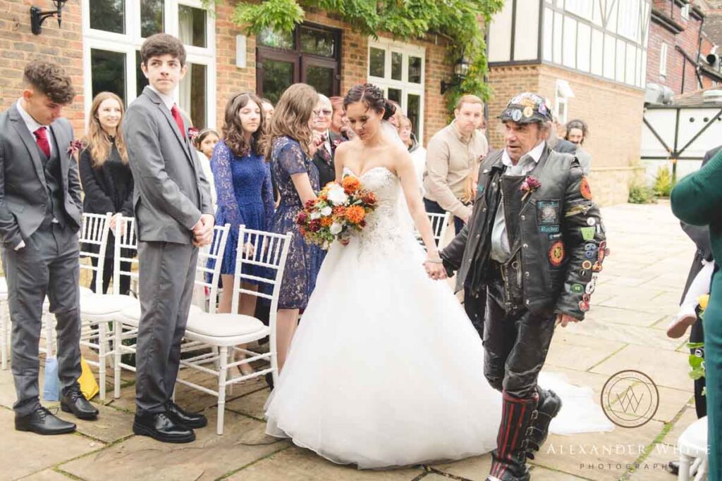 Father walks the bride down the aisle