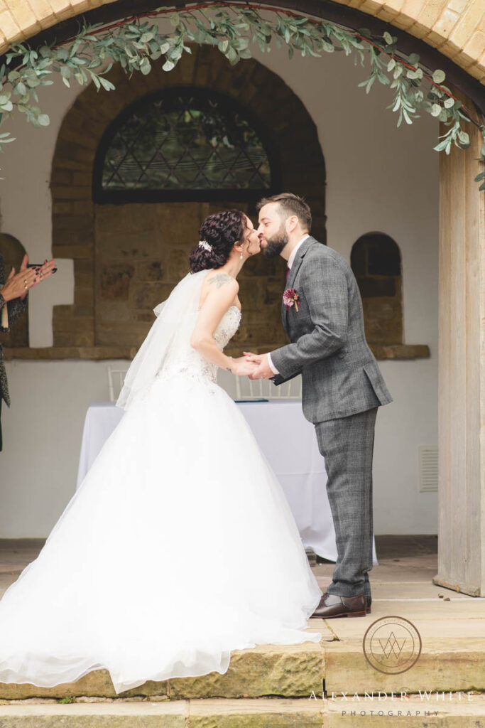 Bride and groom's first kiss