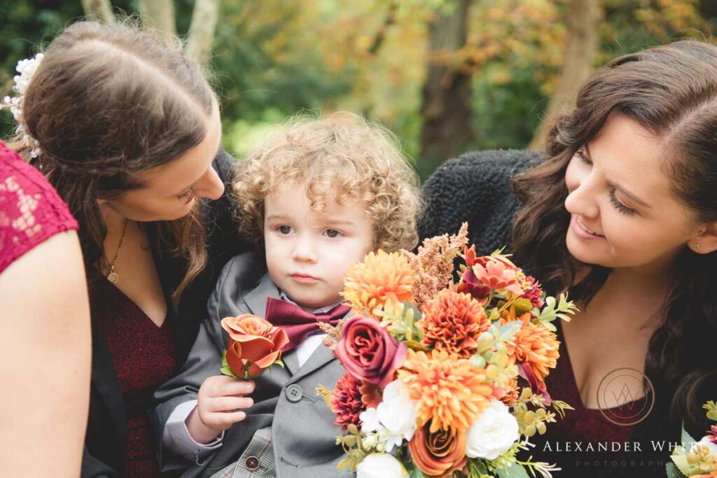 Bridesmaids take of of page boy