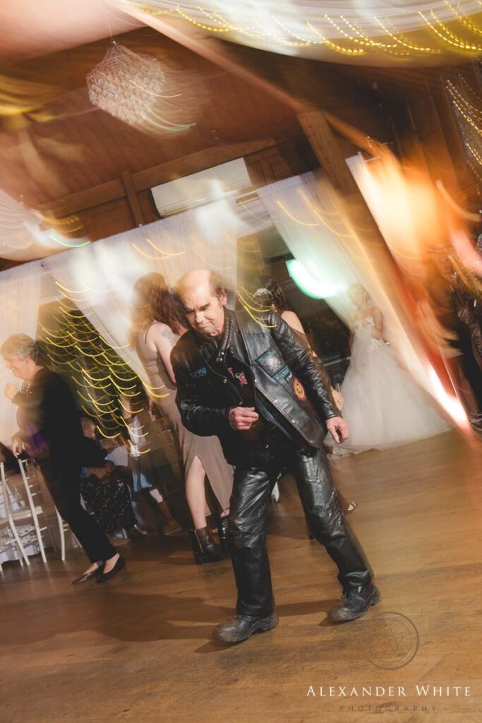 Father of the bride dancing in biker's leathers