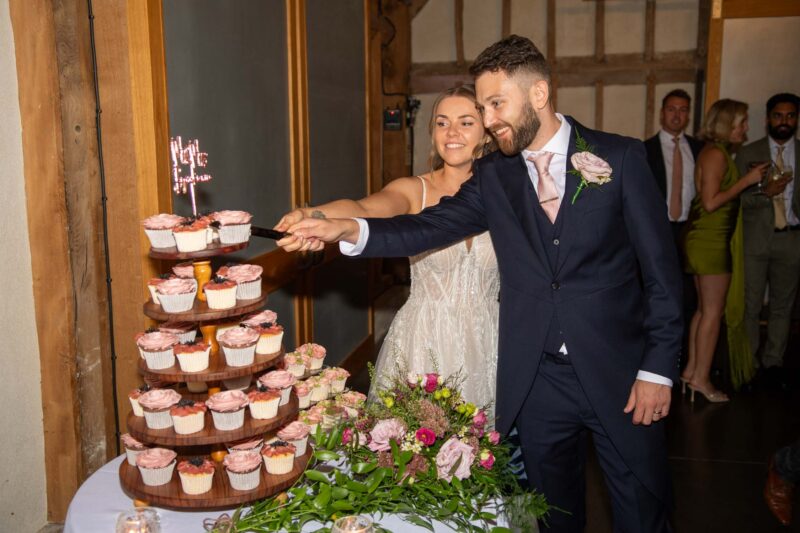 Bridge and groom cutting the cake