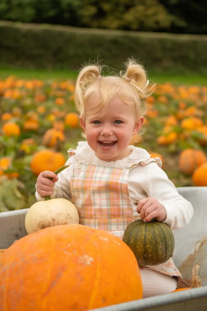 Portrait of a young girl with pumpkins
