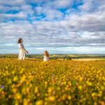 Mother and daughter surrounded by wildflowers