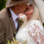 Newlywed Couple kissing - western themed wedding