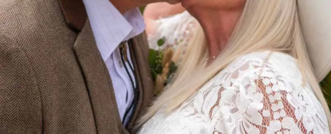 Newlywed Couple kissing - western themed wedding