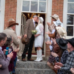 Bride and groom wedding venue exit and celebrations at western themed wedding