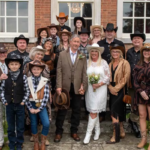 Cowboy themed group photo at a western themed wedding
