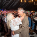 Bride and groom line dancing at western themed wedding
