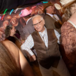 Guests line dancing at western themed wedding in Horsham West Sussex